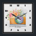 Relógio Quadrado Câmera Laranja Boho e Flores Aquarela<br><div class="desc">Relógio personalizado com seu nome comercial e número de telefone. Projetado com uma ilustração aquosa de uma câmera laranja e um buquê floral descansando no topo. As flores do buquê são rosas claro e laranja com folhas verdes,  um bonito arranjo floral.</div>
