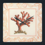 Relógio Quadrado Coral Vermelho com Borda Conch Shell<br><div class="desc">Pegue esta trabalho de arte moderna hoje com fundo creme colorido. Esta peça de arte contém um coral vermelho sombreado que é muito afiado e vívido com uma borda decorativa de concha. É uma obra de arte contemporânea que será perfeita para qualquer tipo de tema náutico que você está tentando...</div>