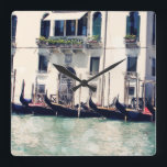 Relógio Quadrado Destinos | Fotografia da frente de água de Veneza<br><div class="desc">Capturada aqui, uma fotografia clássica espantosa ao longo dos canais de Veneza na Itália pela talentosa Sylvia Coomes. Tome todos os maravilhosos detalhes rústicos desta fotografia começando com a fileira de gondolas elegantes alinhadas. Olhe como o sol que se dobra brilha alegremente enquanto a água se mantém firme. A própria...</div>