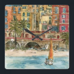 Relógio Quadrado Destinos | Praia e Edifícios Aquarela<br><div class="desc">Uma bela aquarela e design de tinta criada pela brilhante Melissa Wang, trazida a vocês pelo World Art Group. No primeiro plano desta peça podemos ver um pequeno veleiro ao largo de uma pequena praia povoada por vários itens, pessoas e palmeiras. Esta cena pode ocorrer em uma cidade sagrada ou...</div>