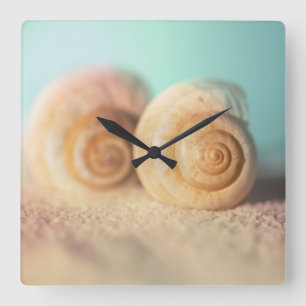 Relógio Quadrado Escudos do nautilus na praia
