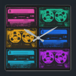 Relógio Quadrado Fitas de Cassete Coloridas Retroativas<br><div class="desc">Nos anos oitenta todos vestiam fones de ouvido e ouviam suas músicas em um tocador de cassetes portátil. Insira seu cassete e você tinha música em qualquer lugar a qualquer hora, até que Side A terminasse e a fita tivesse que ser virada para Side B. As Pessoas poderiam até fazer...</div>