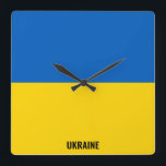 Relógio Quadrado Patriótico de Bandeira da Ucrânia<br><div class="desc">A bandeira da Ucrânia apaga o relógio de parede da praça patriótica nas cores e nos elementos da bandeira nacional da Ucrânia que cobre a frente do relógio. As cores da bandeira nacional são complementadas com o texto "Ucrânia" na parte inferior. O texto é totalmente personalizável usando o recurso "Personalizar!"....</div>