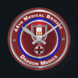 Relógio Redondo 44th Medical Brigade Dragon Medics<br><div class="desc">Display your pride in our 44th Medical Brigade – “The Army’s Premier Medical Brigade – Dragon Medics” This is my newly designed Custom Designed Wall Clock and makes a wonderful gift to any who having family members serving or have served in this unique Brigade! The 44th Medical Brigade has been...</div>