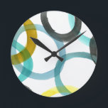 Relógio Redondo Círculos Amarelos e Azuis Interlocados<br><div class="desc">Um impressão simples de interligar círculos amarelos e azuis por Megan Meagher. O fundo branco permite pop das cores dos círculos. Compre o seu hoje!</div>