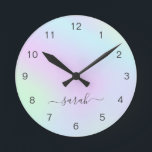 Relógio Redondo Girly Modern Elegant Script Name Holographic<br><div class="desc">Modern wall clock featuring your name in an elegant handwritten script with swashes over a colorful holographic gradient in pastel pink, purple, blue and green. This stylish and feminine wall clock is great for a girly girl and makes a great gift for her.</div>