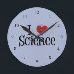 Relógio Redondo I Heart Science<br><div class="desc">Eu adoro ciência. Um relógio cientista geek com um modelo atômico envolto no coração.</div>