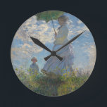 Relógio Redondo Mulher de Monet com um parasol<br><div class="desc">A obra-prima de Claude Monet: Mulher com um parasol.
Visite nossa loja para outros itens de correspondência</div>