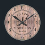 Relógio Redondo Newlyweds Rustic Personalizados<br><div class="desc">Um barninho moderno e rústico,  um escudo de madeira monograma com um relógio de casamento com data estabelecida e nome casado.</div>