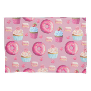 Rosquinhas, cupcakes, e doces cor-de-rosa