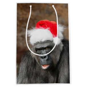 Sacola Para Presentes Média Gorilla Biddy em um Chapéu Festivo de Natal
