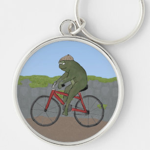 Sapo cavalheiro em uma Chaveiro de bicicleta