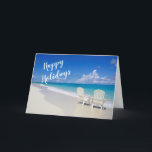 Sunny Beach Com 2 Cadeiras Feliz Cartão De Férias<br><div class="desc">Desejos quentes de Natal da praia! Uma bela praia ensolarada com ondas do oceano caindo na areia. Há duas cadeiras brancas de praia,  de costas,  voltadas para o oceano. Na frente lê-se: "Felizes Feriados". Veja os vários design e estilos em nossa loja.</div>