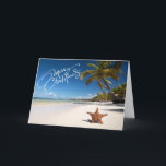Sunny Beach com cartão de Natal Starfish<br><div class="desc">Desejos quentes de Natal da praia! Uma bela praia ensolarada com palmeiras e as ondas do oceano se espalhando pela areia. Há uma estrela na areia na praia. Na frente lê-se "Feliz Natal". Veja os vários design e estilos em nossa loja.</div>