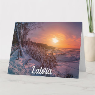 Sunset sobre o cartão da costa da neve