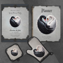 Elegant swans forning a heart together.