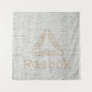 Tapete De Parede Foto de aproximação do logotipo Reebok na parede