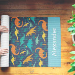 Tapete De Yoga Personalized Kids Dinosaur Pattern<br><div class="desc">Treat your littlest yogi to this cute dino themed yoga mat,  featuring a pattern of T Rex,  brontosaurus,  and more on a navy blue background. Personalize with a name or initials along the bottom.</div>