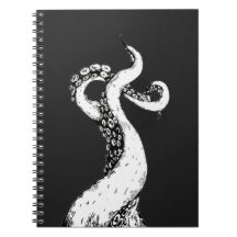 tentáculos de polvo em caderno preto com espiral