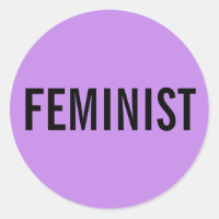Texto negro, feminista e negrito, sobre adesivos d
