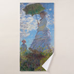 Toalha De Banho Mulher com Parasol, Monet<br><div class="desc">Oscar-Claude Monet (14 de novembro de 1840 - 5 de dezembro de 1926) era pintor francês, fundador da pintura impressionista francesa e o praticante mais consistente e prolífico da filosofia do movimento de expressar as suas percepções antes da natureza, especialmente quando aplicada à pintura da paisagem aérea. O termo "Impressionismo"...</div>