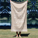 Toalha De Praia Personalized Life Is Better At The Lake<br><div class="desc">Upgrade your outdoor setup at your lakeside abode with this cute personalized beach towel featuring the phrase "life is better at the lake" in white lettering accented with an anchor and an oar. Personalize with your family name and/or year established beneath. Perfect for lake house housewarming parties, summer homes, or...</div>