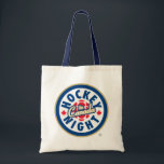 Tote Bolsa de logotipo da noite de hóquei no Canadá<br><div class="desc">Logótipo utilizado desde 1998. Hockey Night no Canadá é a marca usada para apresentações de televisão canadenses da National Hockey League. Embora o nome tenha sido usado para todas as transmissões NHL na CBC Television (independentemente da hora do dia), a Hockey Night no Canadá é principalmente associada às suas transmissões...</div>