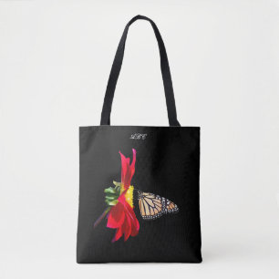Tote Monarca vermelho da dália toda sobre o bolsa do