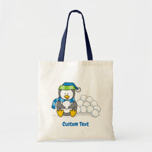 Tote Pequeno pinguim sentado com bolas de neve na bolsa