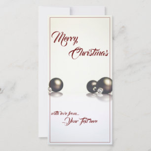 Três bolas de natal em frente ao fundo da luz