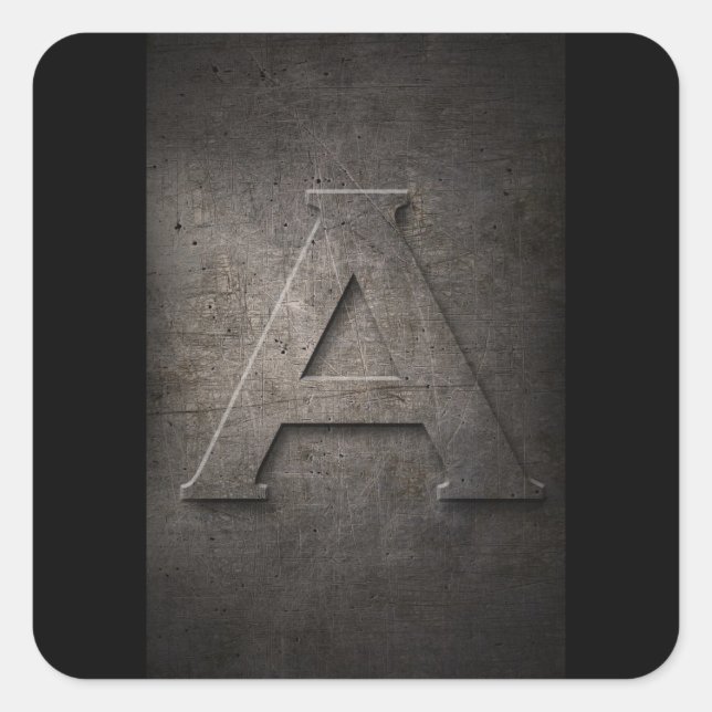 Um adesivo de monograma metálico (Frente)