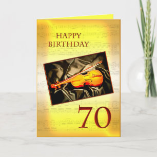 Um cartão musical de aniversário de 70 com violino