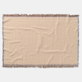 Um cobertor xadrez gingham em tons de bege 
