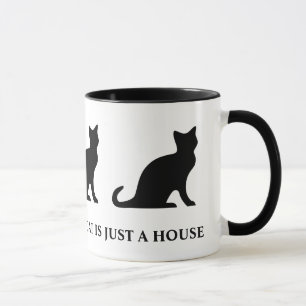 Uma casa sem um gato, só uma caneca de café.