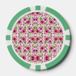 Uma ficha de pôquer com um padrão floral em rosa