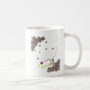 Uma galinha e um pintinho de caneca de café