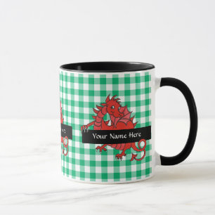 Uma pequena caneca de café com dragão vermelho par