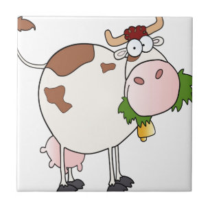 Vaca dos desenhos animados que come a grama