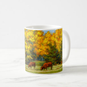 Vacas vermelhas sob a caneca amarela das árvores