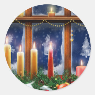 Vela nas etiquetas do Natal da janela