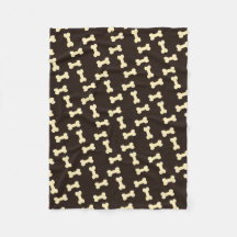 Ossos de cão no cobertor de cães-padrão castanho