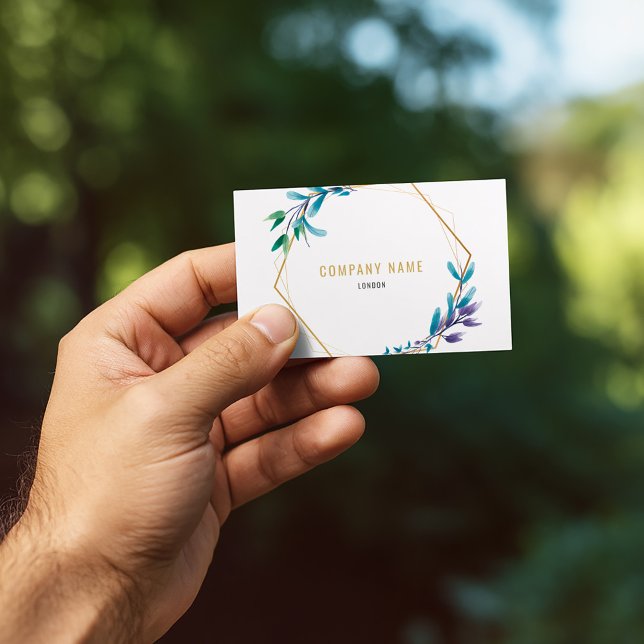 Visita Coroa de flores geométricas douradas cartão de neg (Elegant business card with gold geometric frame and watercolor botanical accents.)