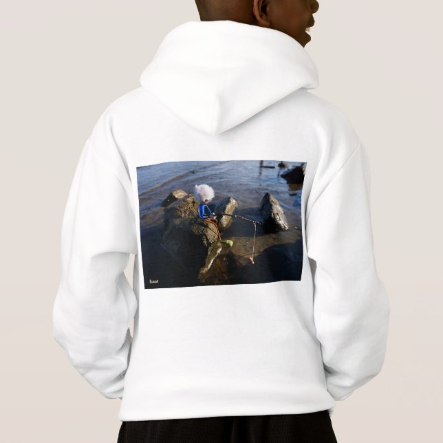 Vissende Fubby op een steen. (Verso)