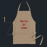 Whatcha engraçado obteve o avental do cozimento do<br><div class="desc">O avental de Tan com o "Whatcha obteve Cookin" na parte dianteira
Presente perfeito para tudo que como a estar na cozinha.</div>