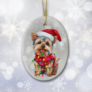Yorkie em ornamento cerâmico à luz do Natal